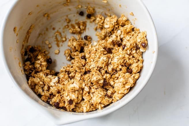 combining oats with peanut butter and banana mixture