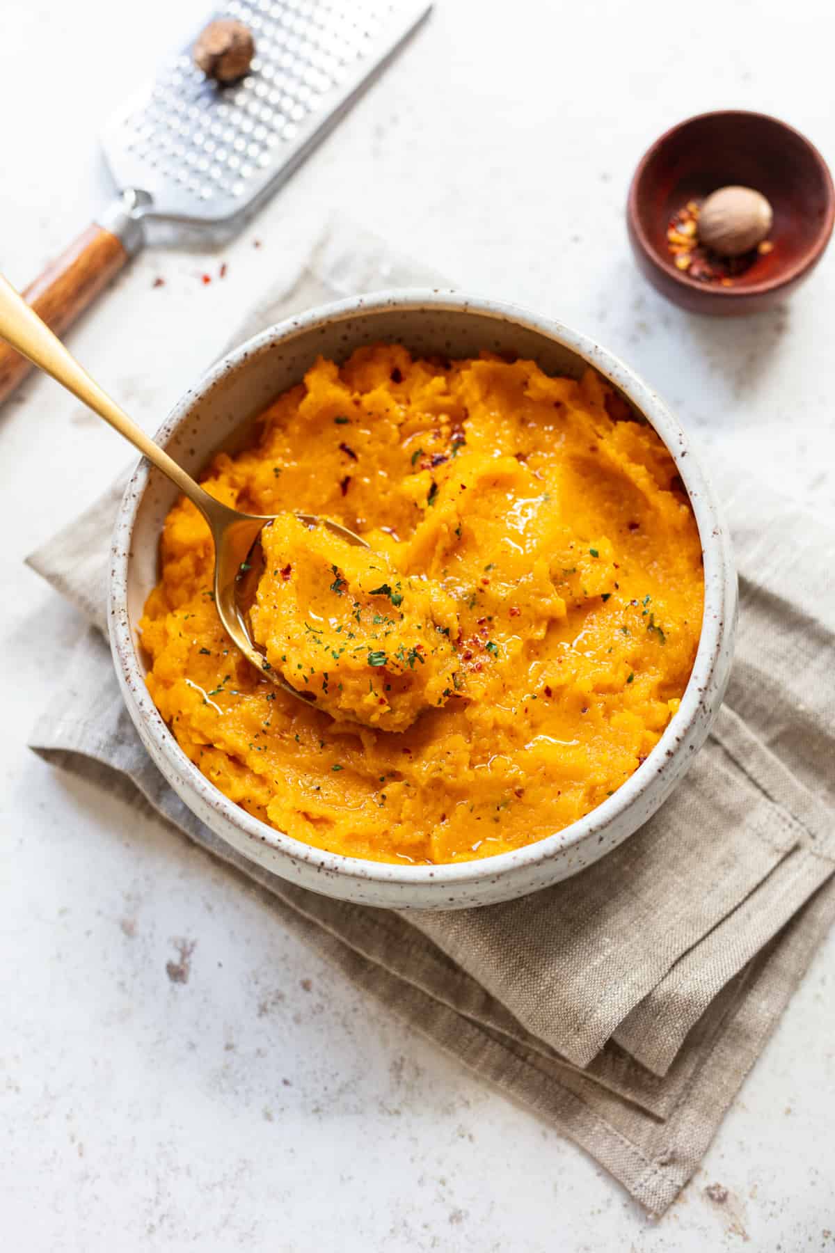 mashed butternut squash with spoon