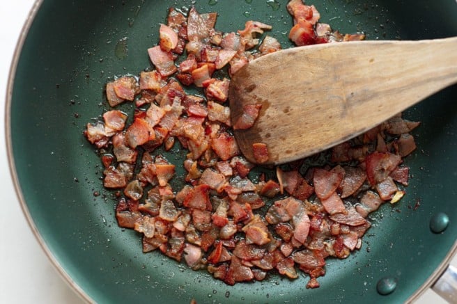 cooking pancetta in a large skillet