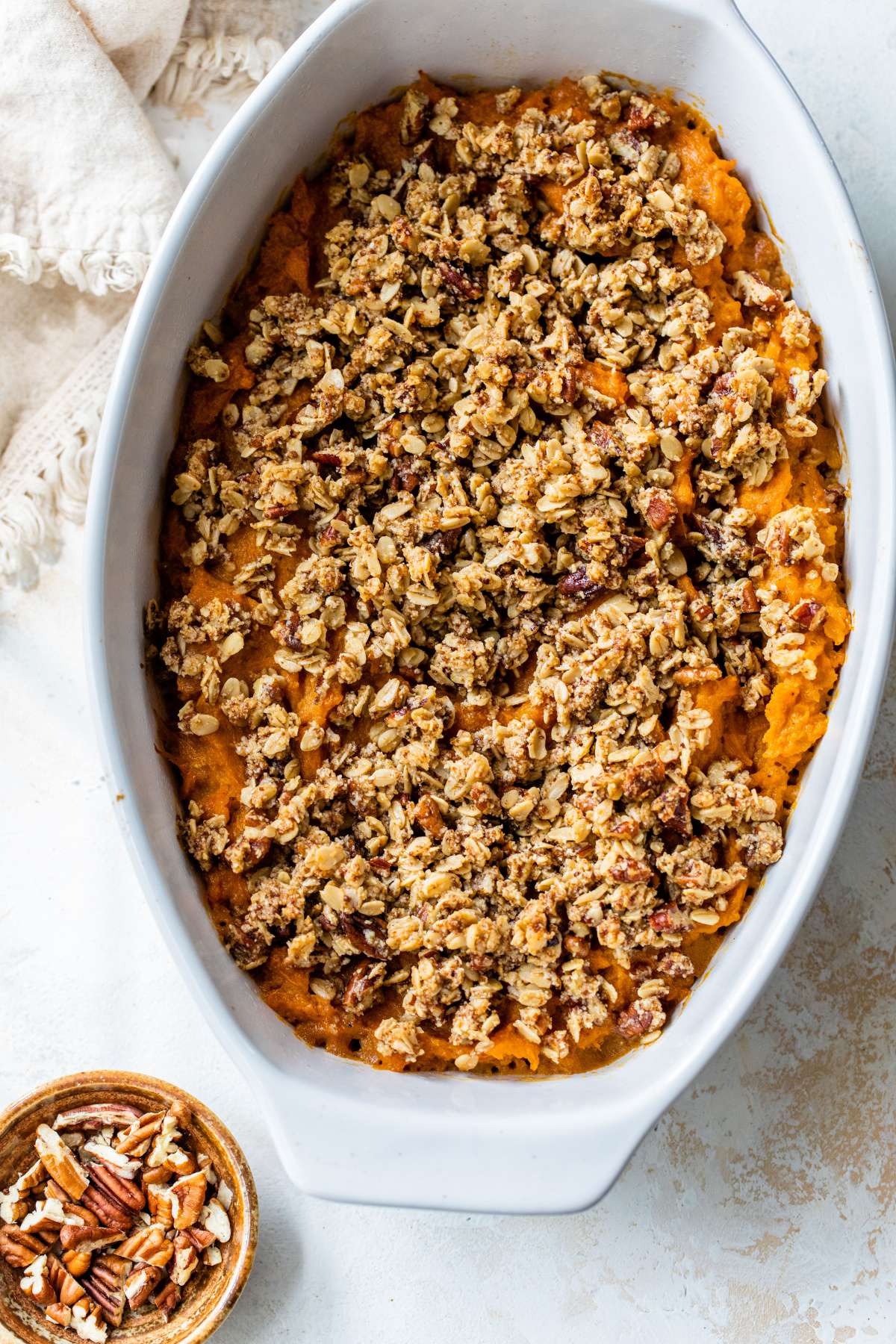 Topping sprinkled over sweet potato casserole.