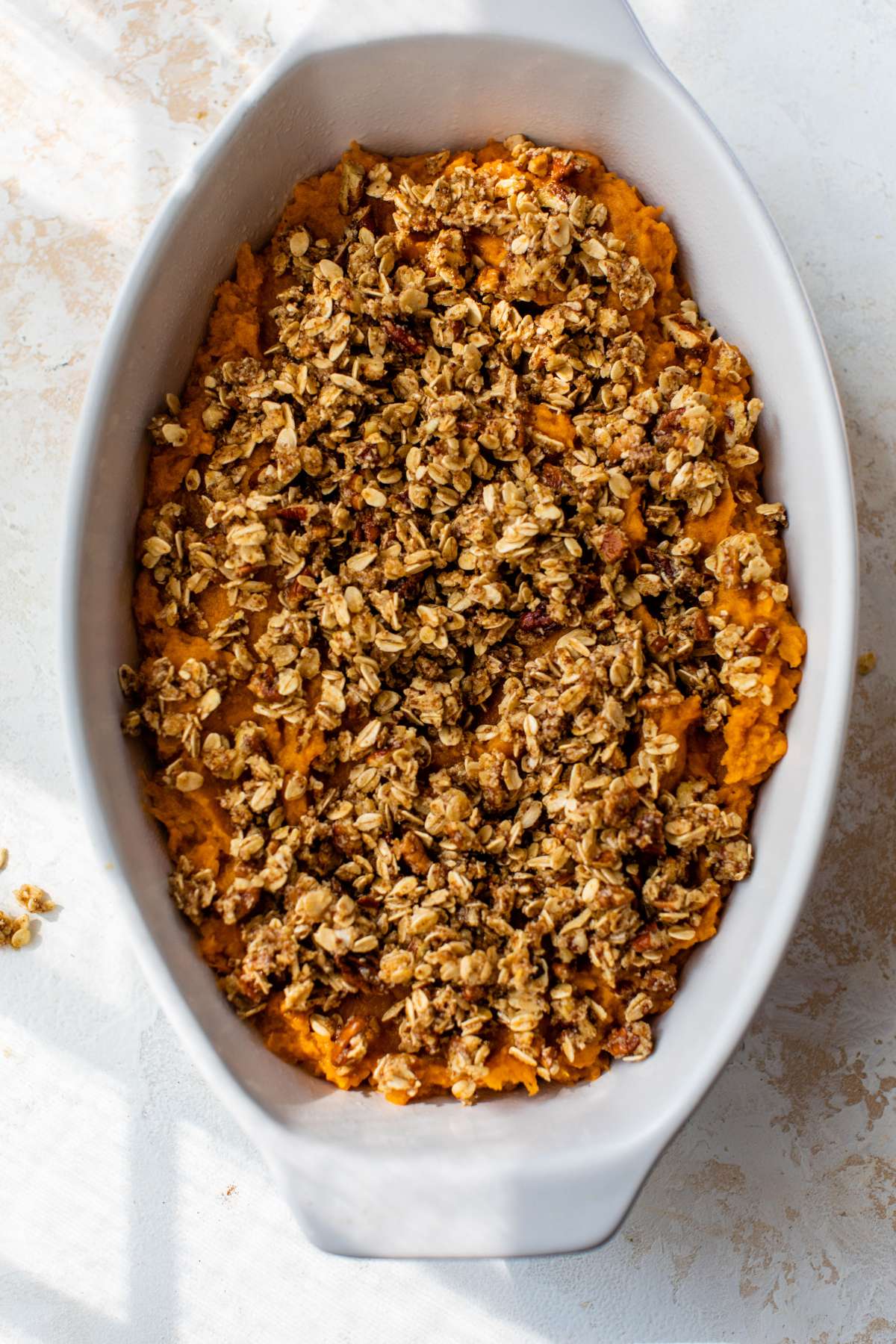 Baked sweet potato casserole with pecan oat topping.