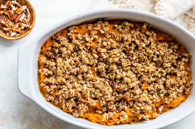Baked sweet potato casserole with pecan oat topping.