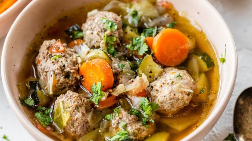 meatball and vegetable soup topped with cilantro