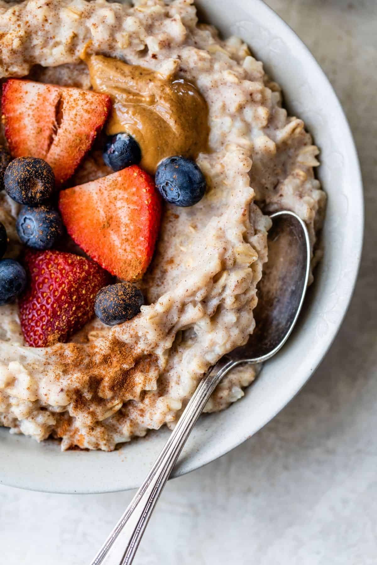 oatmeal with a spoon and fresh berries