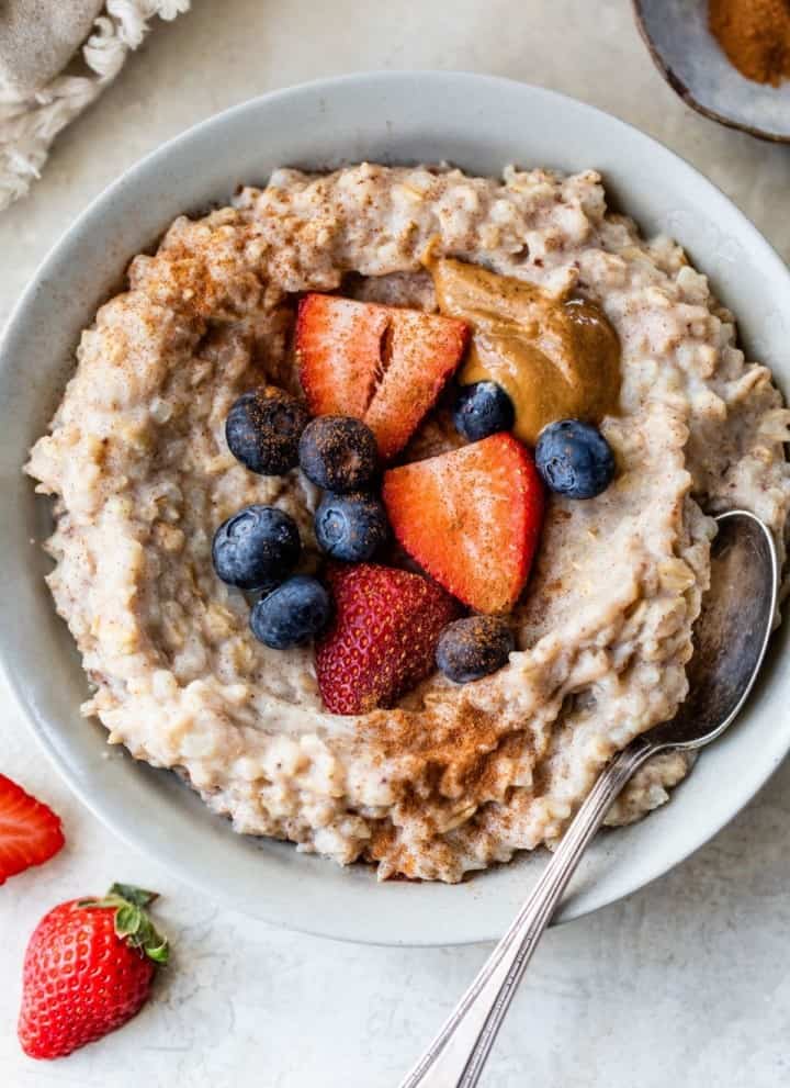 cauliflower oatmeal topped with berries