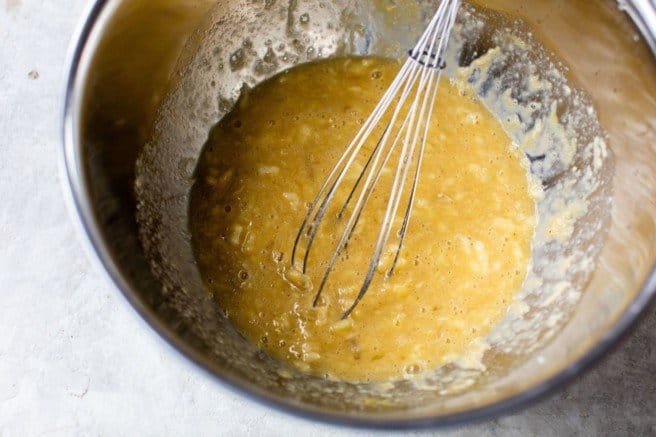 Whisking eggs with bananas.