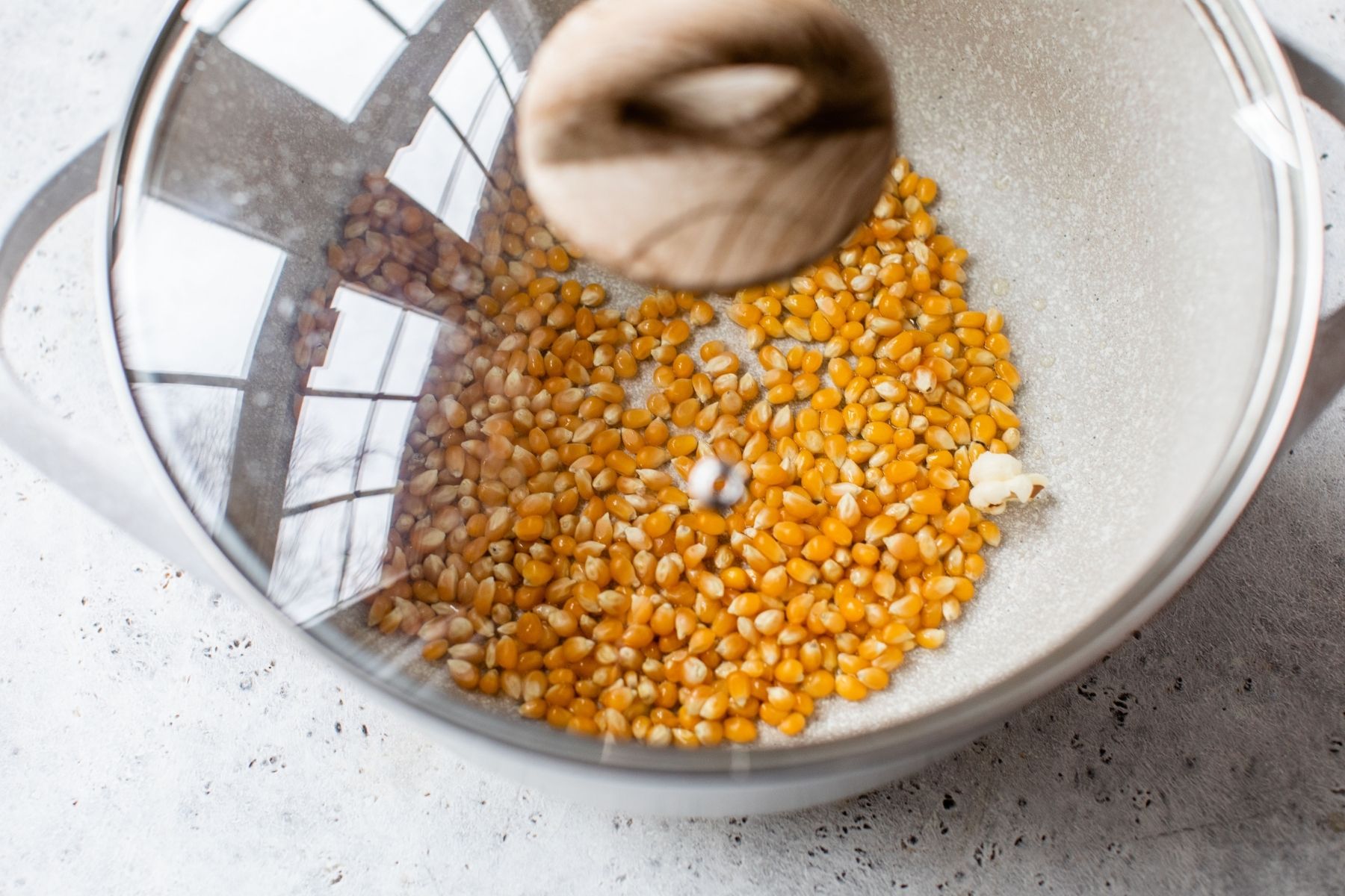 Adding kernels to large pot.