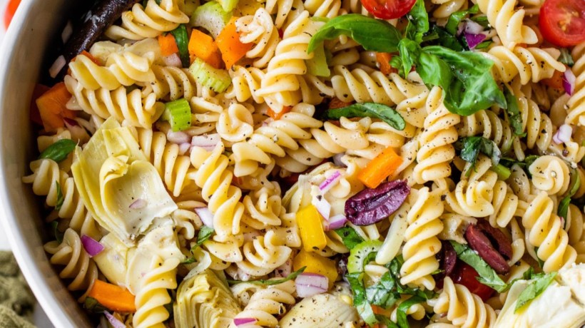 Italian pasta salad in a large white serving bowl.