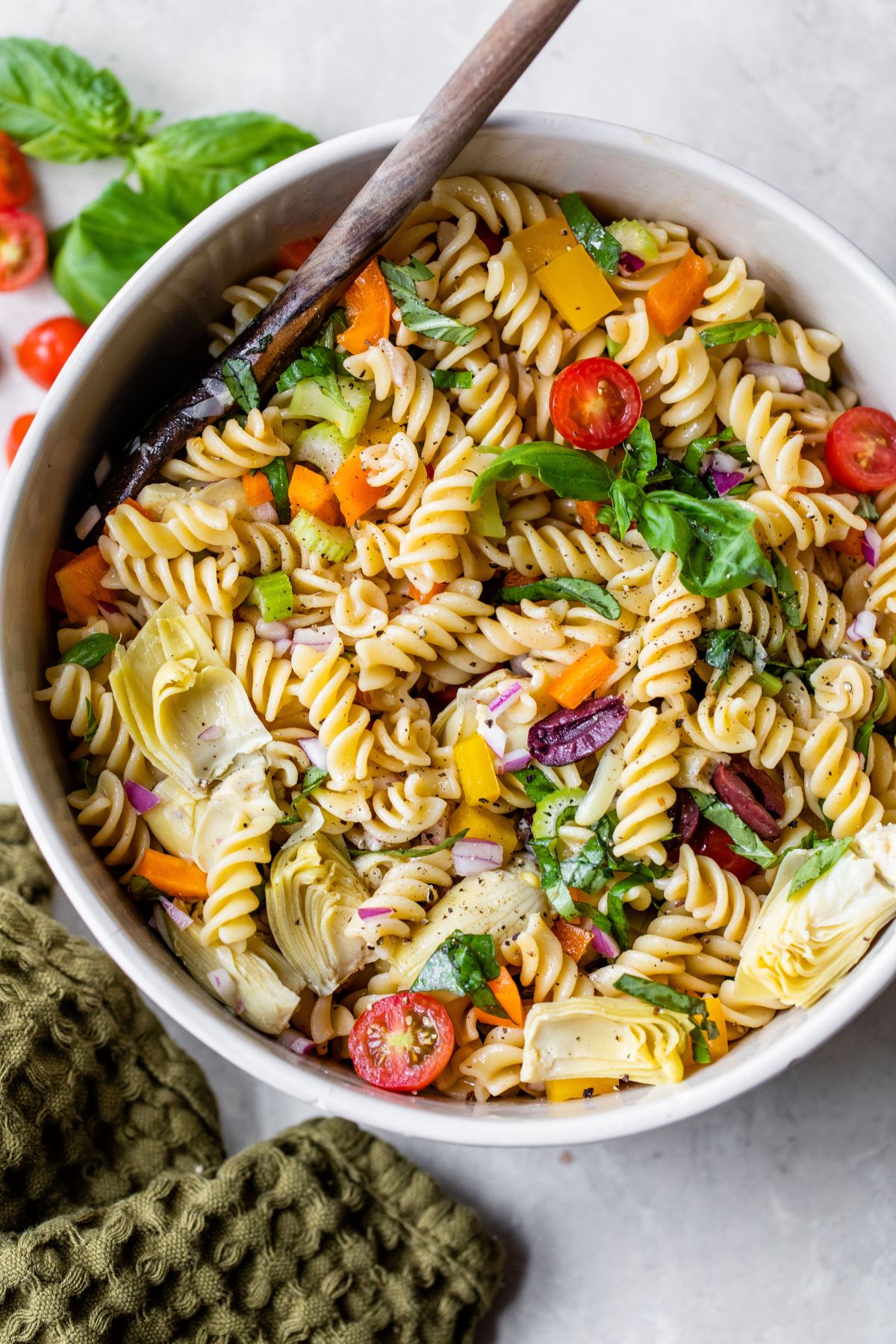 Italian pasta salad in a large white serving bowl.