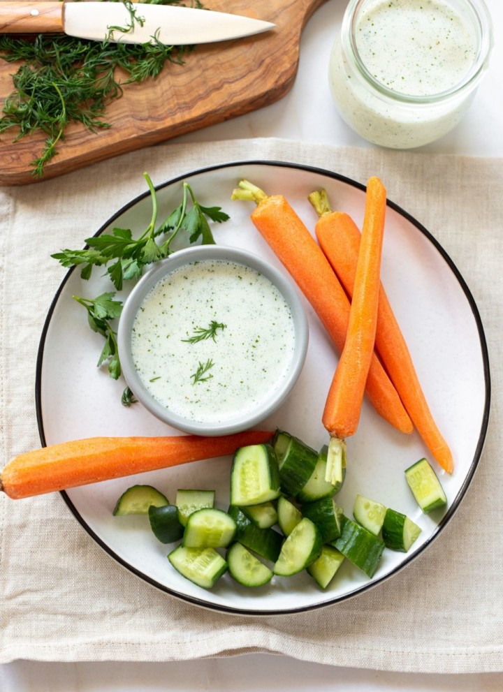 Buttermilk ranch dressing in a small bowl served with veggies.