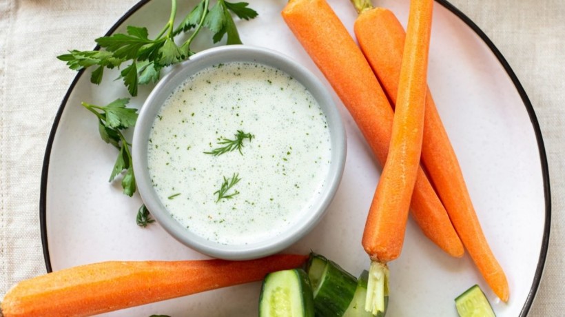 Buttermilk ranch dressing in a small bowl served with veggies.