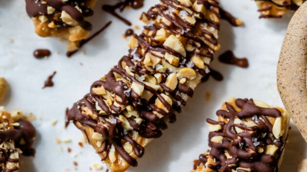 Frozen bananas drizzled with chocolate.