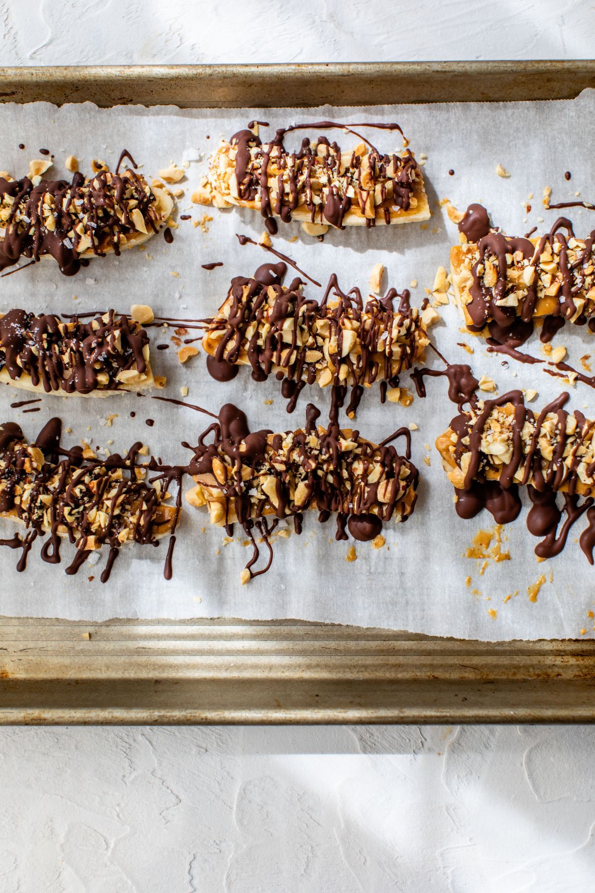 Bananas covered with peanut butter and chocolate.