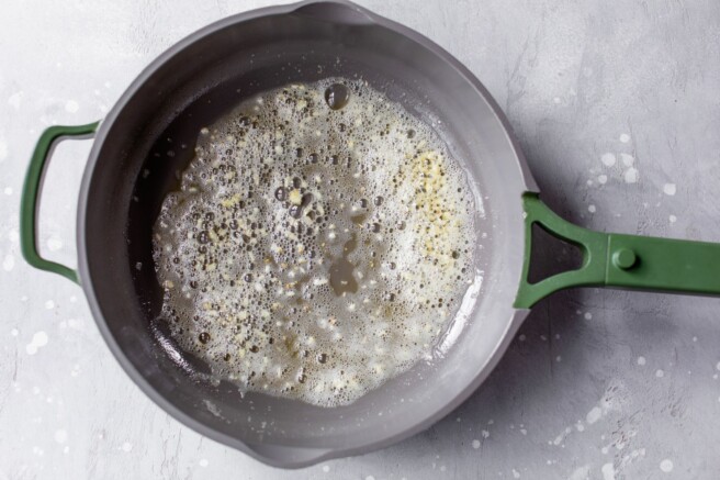 Sautéing garlic in a pan.