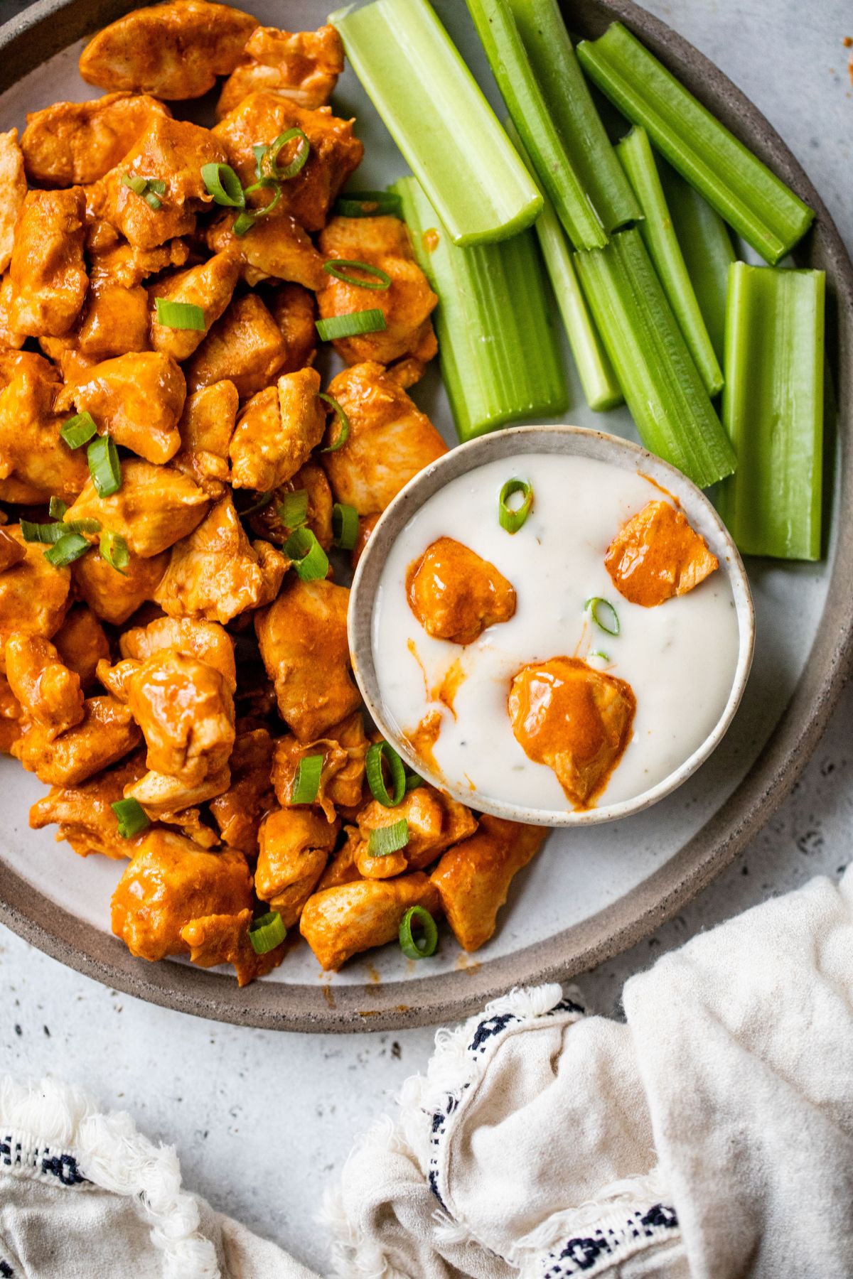 Buffalo chicken bites dipped in a creamy white dressing.