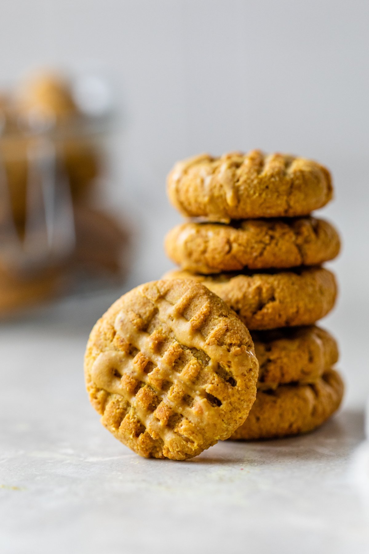 homemade peanut butter dog treats stacked in a pile