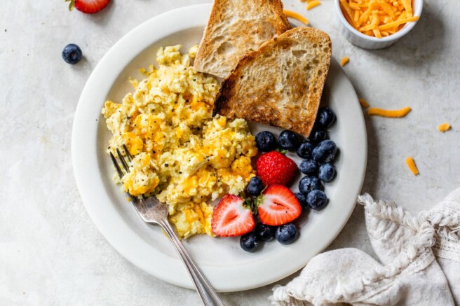 Serving cauliflower eggs with toast and berries.
