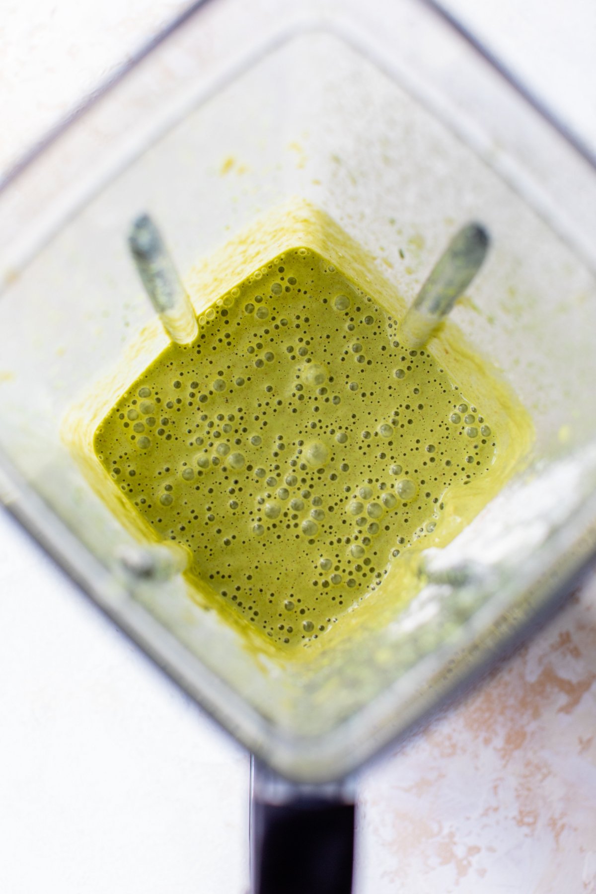 spinach pancake ingredients blended together in a blender