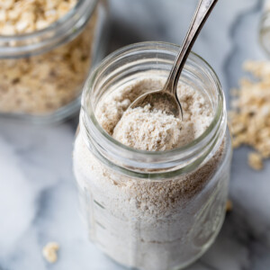 homemade oat flour stored in a glass jar