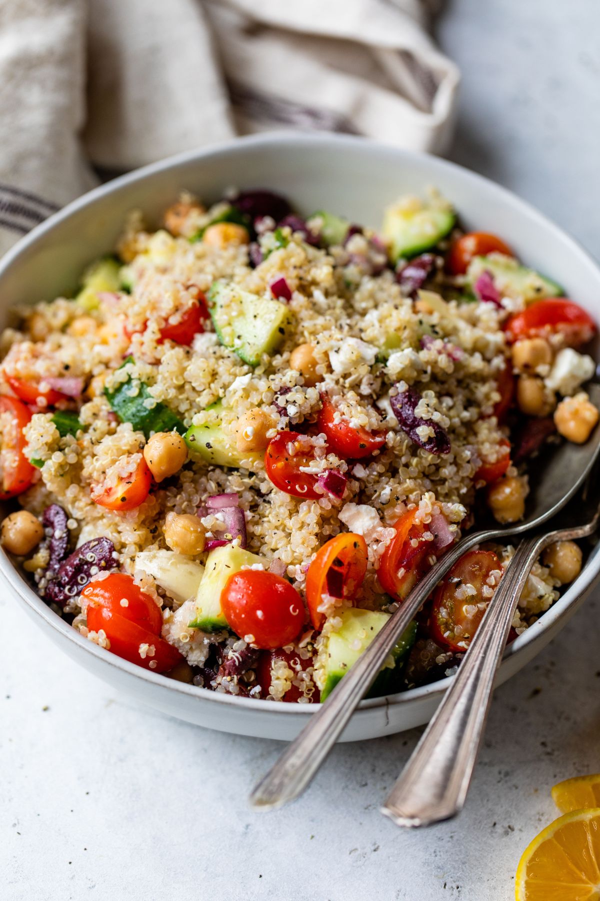 Greek quinoa salad with cherry tomatoes, cucumbers and feta.