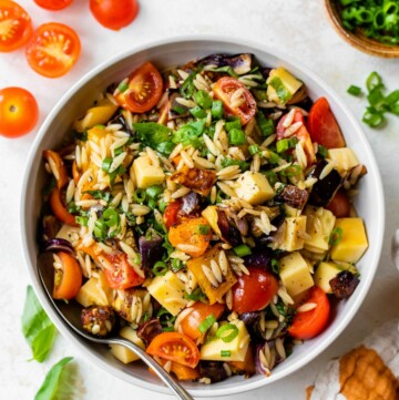 Pasta salad made with orzo and roasted vegetables.