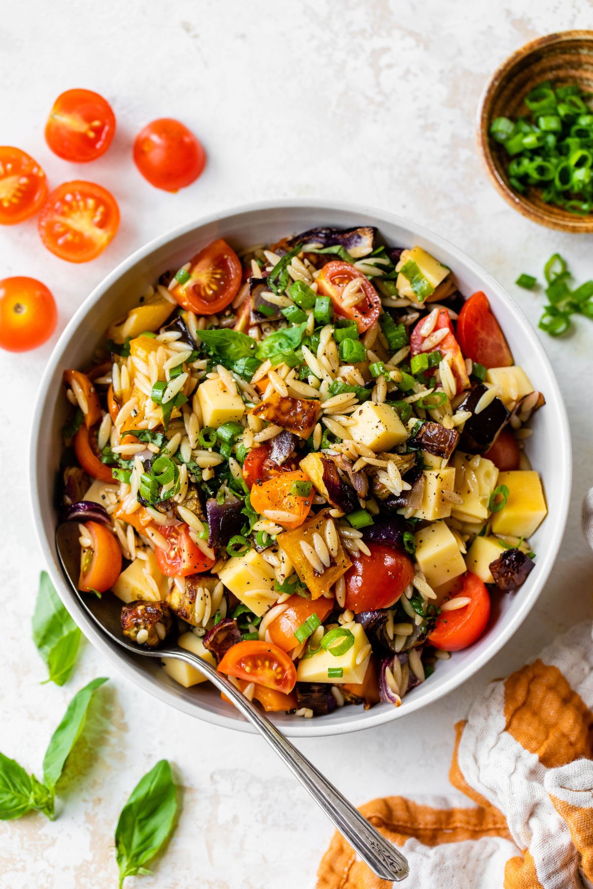 Pasta salad made with orzo and roasted vegetables.