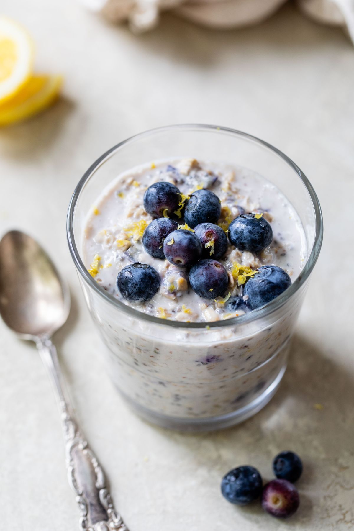 Blueberry lemon overnight oats in a small glass.