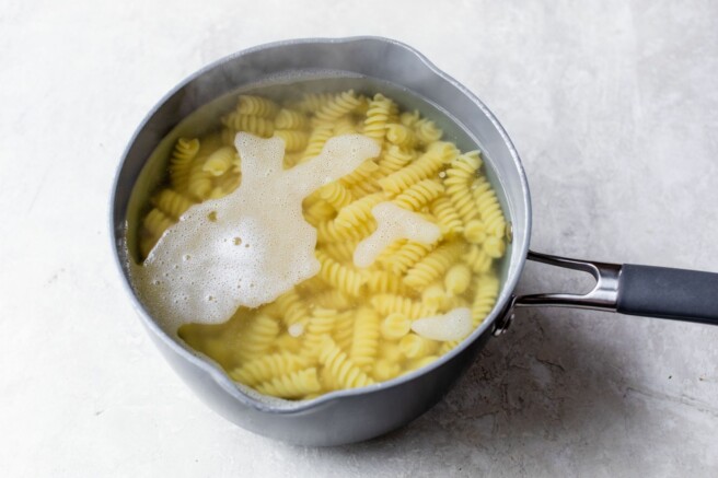 Pasta cooking in a pot of water.