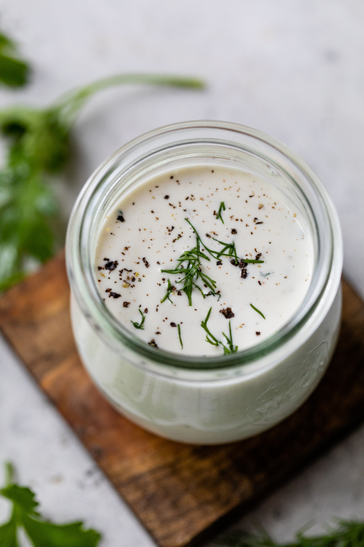 rich and creamy buttermilk dressing in a small glass jar