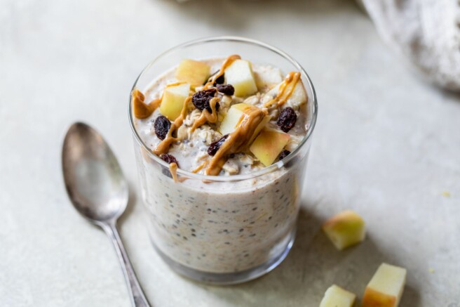Overnight oats topped with chopped apple, raisins and peanut butter.