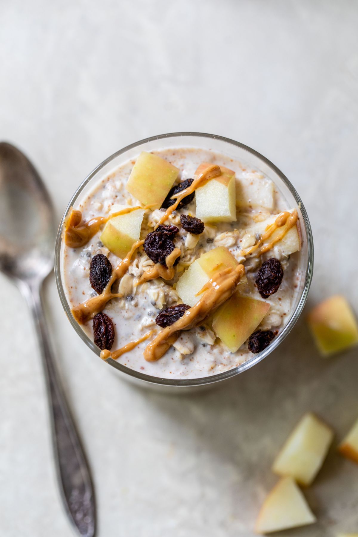 Apple pie overnight oats drizzled with peanut butter.