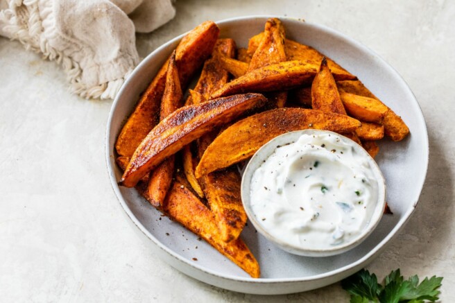 creamy dipping sauce with a sweet potato fry dipped in