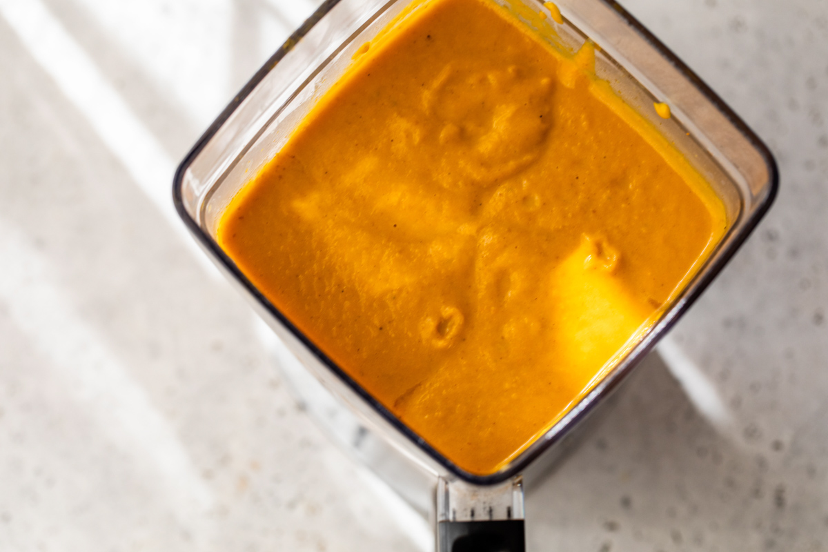 pumpkin curry soup blended togetehr in a blender