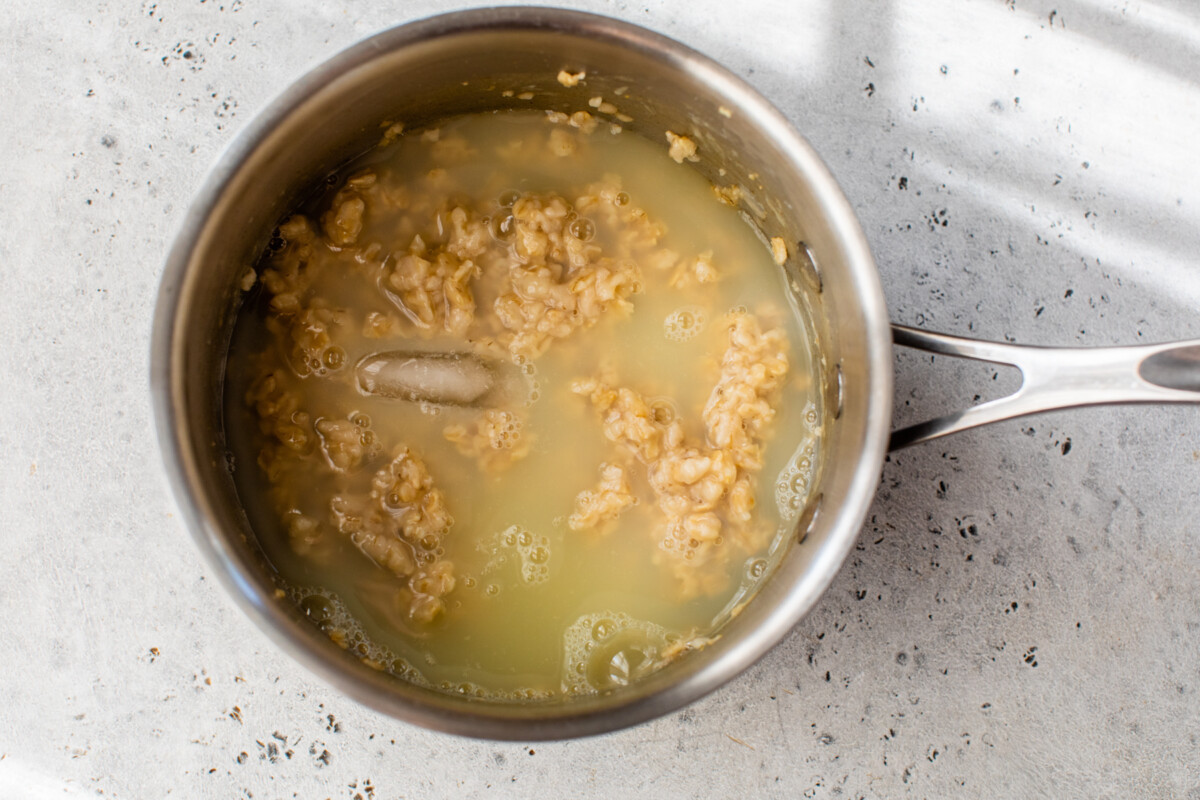 egg whites and ice cubes are added to partially cooked oats