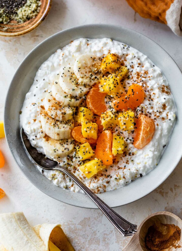 Cottage cheese topped with mango, banana slices, and clementine.
