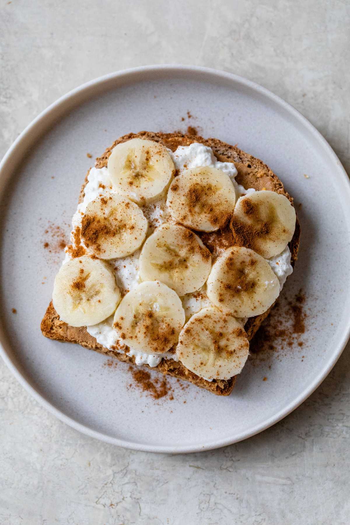 Toast topped with peanut butter, cottage cheese and sliced banana.