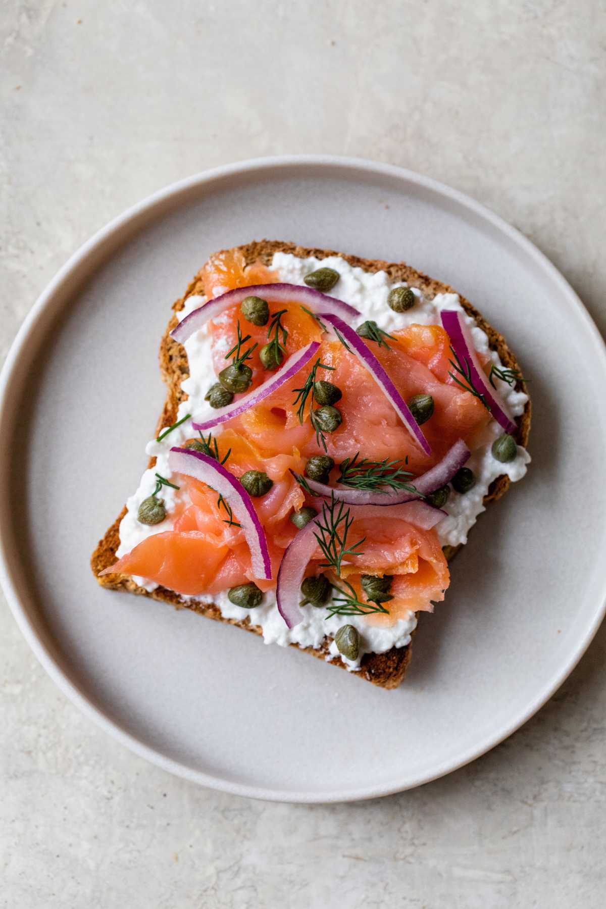 Toast topped with cottage cheese and smoked salmon.