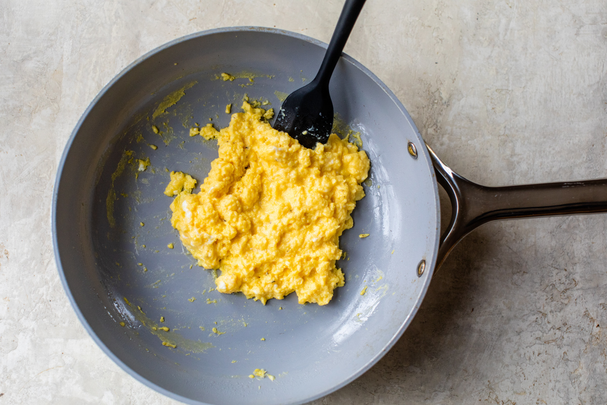 creamy, fluffy. scrambled eggs with cottage cheese cooked in a saute pan