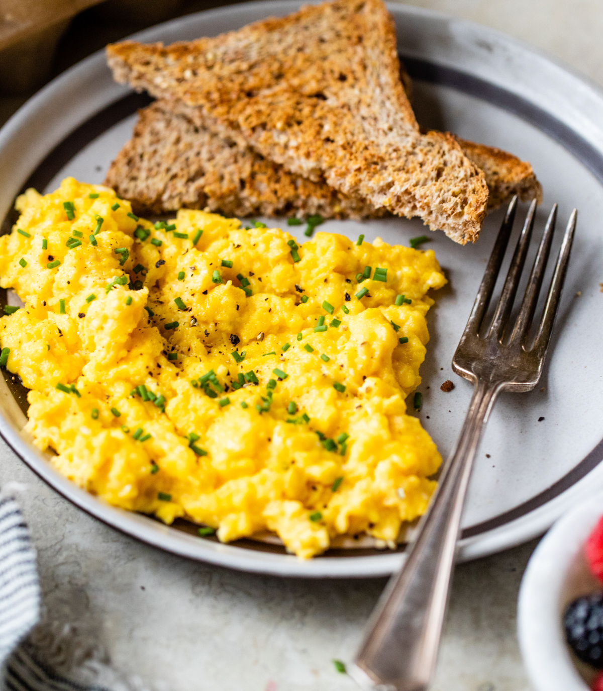scrambled cottage cheese eggs topped with fresh chives