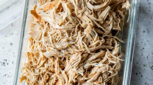 Shredded chicken in a meal prep storage container.