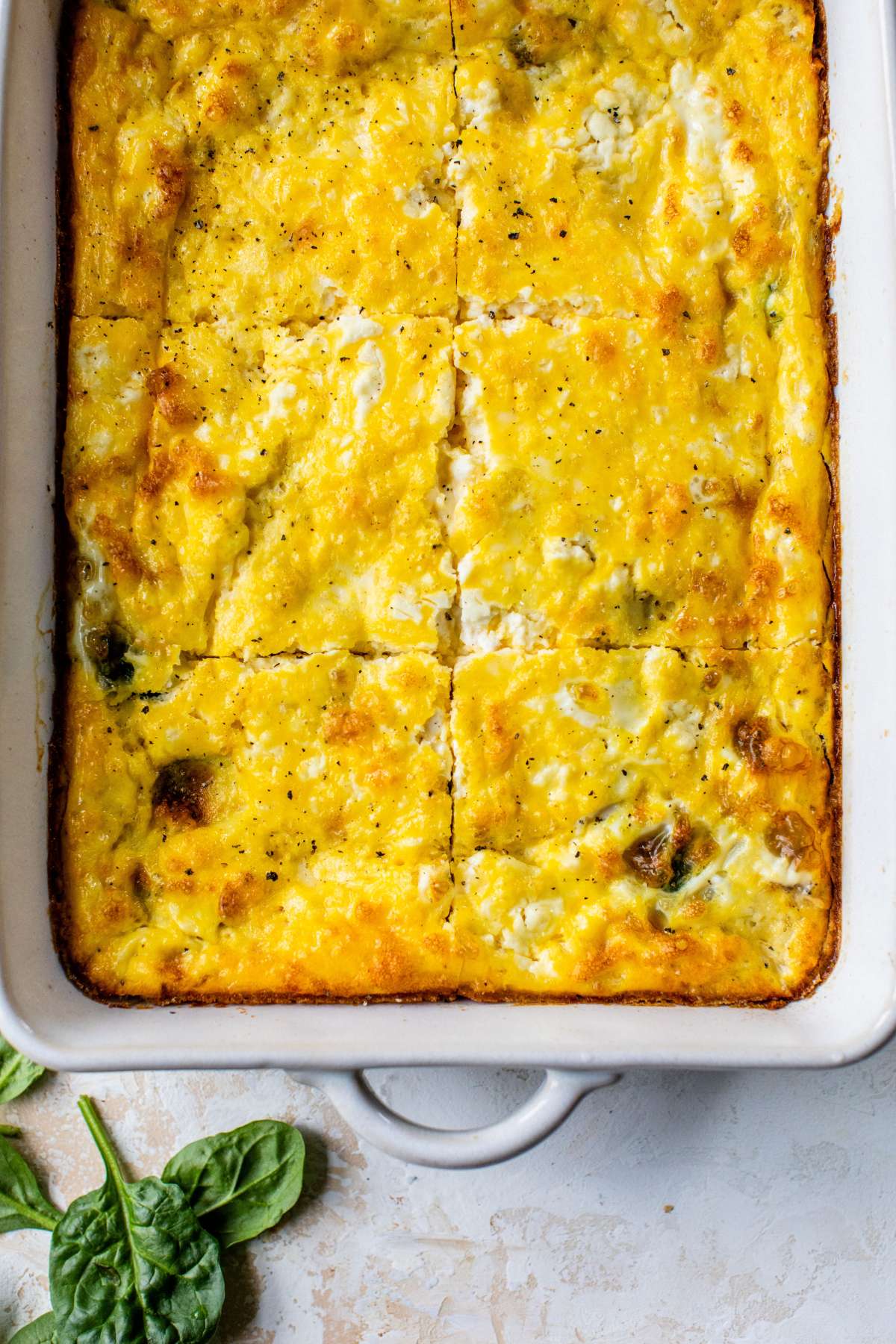 Baked egg and cottage cheese bake cut into portions.